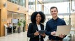 © StockSphere - Young happy professional work team of two diverse confident female and male partners employees business people man and woman standing together in office looking at camera, corporate portrait.