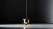 © Van - Golden pendulum swinging in a dark room representing time and motion