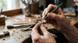 © dals stock - Closeup of jeweler crafting jewelry with precision tools in workshop.