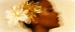 © tania_wild - Surreal fashion portrait of a woman with a golden abstract accessory and white flower