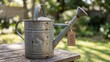 © Muliana - Old galvanized metal watering can with a 'R300' price tag sits on a rustic wooden table in a sunny garden.