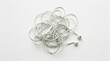 © Immersive Dimension - Tangled White Headphone Cords Create A Chaotic Mess On A Clean White Surface, Symbolizing Frustration And Disorganization.
