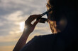 © Víctor Sánchez - Person using solar eclipse glasses for safe total or annular solar observation, watching celestial event