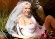 © kavardakova - sexy homosexual man laughs and poses in bride's dress
