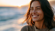 © Laura - Close-up of a cheerful brunette woman laughing naturally on the beach at sunset, authentic emotion and summer vacation happiness, coastal lifestyle and natural beauty concept,