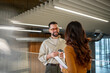 © Migma_Agency - Employees communicating during coffee break in modern office