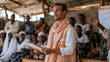 © forenna - A group of international volunteers at a rural clinic on World Population Day distribute maternal health information packets to young mothers seated on wooden benches under a corrugated metal roof,