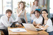 © JackF - Portrait of group of young businessmen at table watching presentation with interest during a business meeting