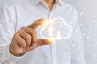 © Kunal - Business professional touching a cloud computing icon representing digital technology
