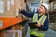© Serhii - Warehouse, shipping and man walking in a distribution, freight and supply chain company. Worker, contractor and back with stock, factory and export business with employee working with storage