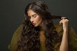 © millaf (Nemchinova) - Beauty portrait of woman hair. Beautiful model with long curly hairstyle posing