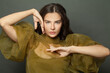 © millaf (Nemchinova) - Closeup portrait of brunette woman with long healthy hair on dark background
