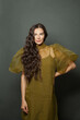 © millaf (Nemchinova) - Smiling brunette woman with long healthy hair on dark background
