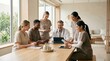 © 5 Grace Media - Diverse medical team collaborating around a table in a modern hospital setting.
