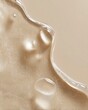 © Анна Мартьянова - Close up transparent serum texture with fine shimmer and smooth curved lines on warm beige background. Skincare concept focused on glow and hydration.