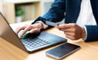 © Father_Studio - Businessman using credit card and laptop for online shopping and payment in cyberspace, digital transaction, ecommerce concept and modern financial technology.