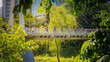 © Sepe44 - Busy commuters walking through a green urban park in Pangyo Techno Valley (Modern office workers in a lush green office district, a sustainable urban environment in spring)
