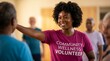 © Aurora Aesthetics - volunteer woman black african portrait community wellness charity smile help kindness african american volunteer in community wellness shirt smiling for nonprofit charity diversity editorial
