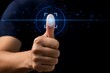 © Image Alchemy - Person's thumb with a glowing digital fingerprint is presented against a dark background for biometric security.