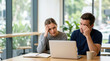 © Xenia - Stressed couple looking at laptop in cafe. Frustrated travelers having booking issues
