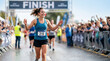 © Xenia - Smiling female marathon runner crossing the finish line. Happy woman celebrating victory in a road race. Athletic achievement and fitness concept