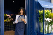 © ADDICTIVE STOCK - Florist working in a blue flower shop