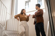 © ADDICTIVE STOCK - Coworking team talking on office staircase during break