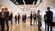© graphicssajib - Group of business people standing and talking in a large modern conference hall with white walls and shiny floor