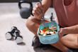 © New Africa - Athletic young man with tasty salad and eggs in lunch box indoors, closeup