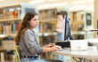 © JackF - Girl searches for information on the internet using computer in a university library