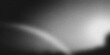 © sutthichai - Abstract black and white background featuring a heavy film grain texture over a blurred, glowing wave pattern resembling liquid motion silk fabric or a smoky light effect