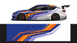 © Lailatul - Blue and white race car with bold orange racing stripes and sleek aerodynamic design.