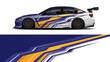 © Lailatul - Side profile of a sleek race car with bold yellow, orange, and blue stripes in dynamic livery.