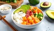 © motor - A bowl of rice and vegetables with avocado slices on top