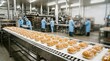 © Barca - Industrial bakery production line with workers in blue uniforms packaging bread rolls on a conveyor belt