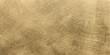 © PS  GALLERY  - A close-up macro shot reveals the textured surface of brushed brass metal, showcasing its warm golden hue and intricate linear patterns created by the finishing process.