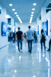 © heerim studio - Blurred People Walk Inside a Bright and Modern Exhibition Hall or Mall