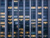 seamless texture highrise building facade at night illuminated window pattern regular structure architecture tile