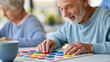 © Nataliya - Close-up of a senior man playing memory skill games with a caregiver at a geriatric facility, cognitive care concept, senior memory game photography, dementia support lifestyle,