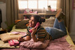© pressmaster - Teenage girl lying on bed and talking on retro landline phone, expressing friendship and nostalgic communication. Ideal for youth lifestyle, teen culture, social connection marketing