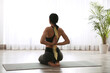 © New Africa - Woman practicing yoga indoors. Illustration of spinal column on her back