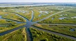 © Kalimo - Radiating Waterways of a Lush Delta Converging in a Natural Starburst Pattern.