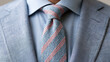 © Nick - Close-up of a man wearing a light blue suit and a striped tie