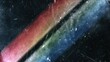 © Robbie - Abstract worn‑textured backdrop with two broad parallel light streaks cutting through dark scratched surface, left streak blending red‑pink‑orange tones, right streak transitioning light green‑light
