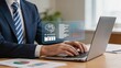 © Benjamin - Professional businessman working on laptop with AI assistant hologram, digital transformation, artificial intelligence technology, data analysis, smart office automation concept.