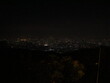 © HyrositoDesign - Stunning panoramic nightscape of a vast city illuminated under the dark sky and Beautiful scenic view of glowing city lights twinkling in the dark night.