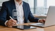 © Jieun - Businessman signing digital contract on tablet in modern office, corporate agreement verification, legal document approval, professional executive working with laptop, remote work