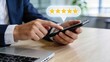 © Wei - Customer giving five star rating review on smartphone, positive feedback concept, online shopping satisfaction, mobile app user experience, excellent service quality and client