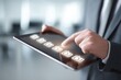 © juwairiya_nameera - Businessman checking off tasks on digital checklist tablet screen
