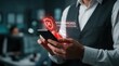 © Masque - Man using a smartphone with a system hacked warning alert and fraud call center notification.